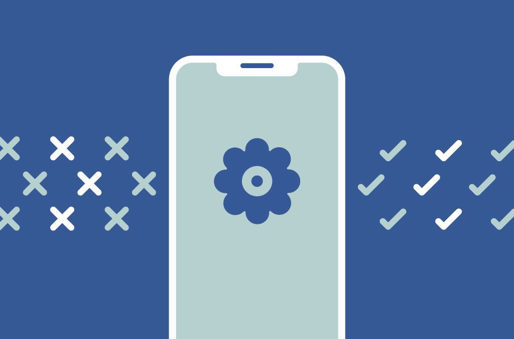 Un teléfono con un ícono de engranaje en medio de la pantalla. Cuatro cruces y cuatro marcas en cada lado del teléfono.