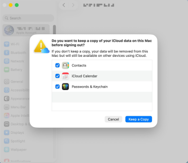 Pop-up window on a Mac asking if the user wants to keep a copy of the data on their Mac before signing out.