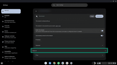 The arrow next to the Wi-FI network name in Settings highlighted.