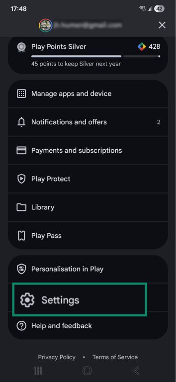 Android Play Store profile management interface with the Settings option highlighted.
